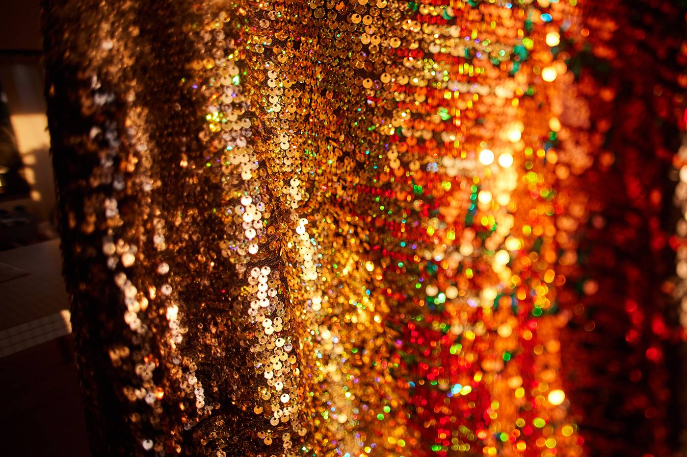 Warm golden light scattering across an evening celebration at Ocean’s Garden